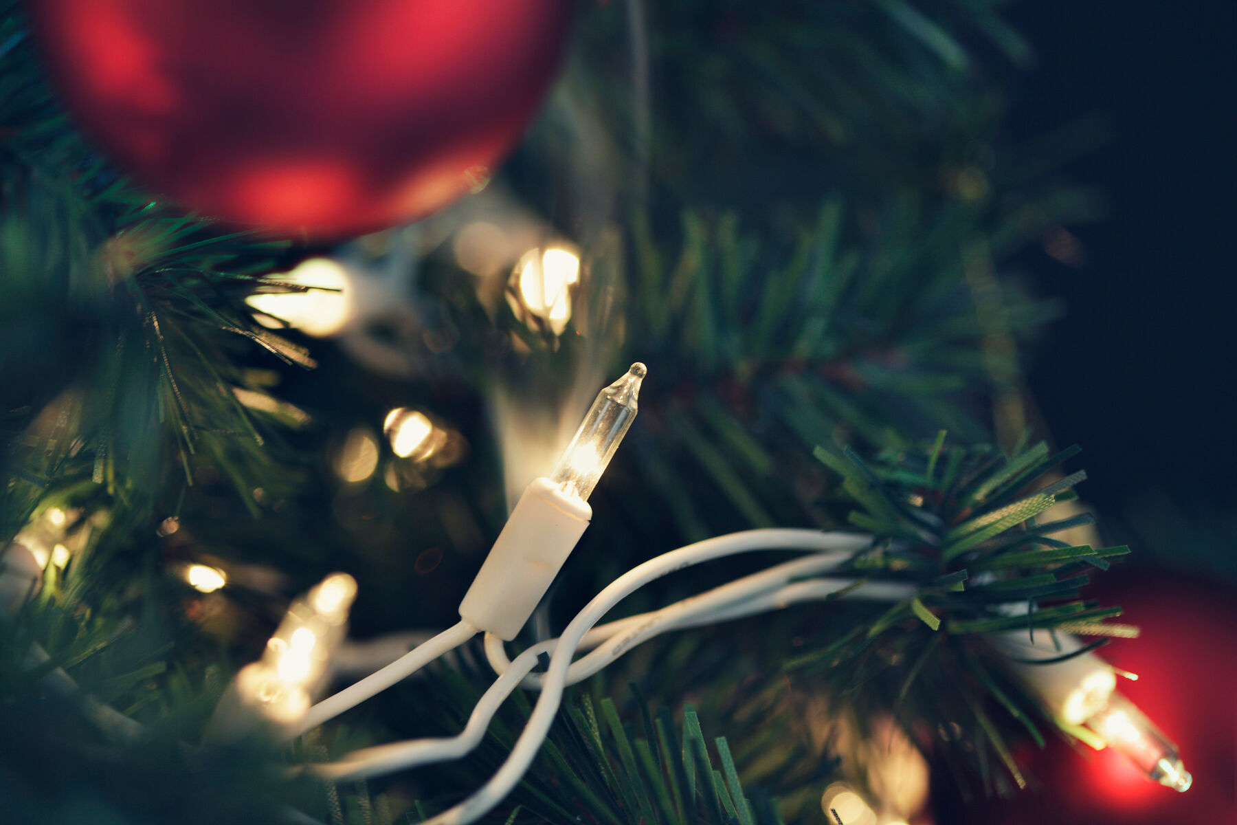 close up of lights on a holiday tree that appears to be smoking