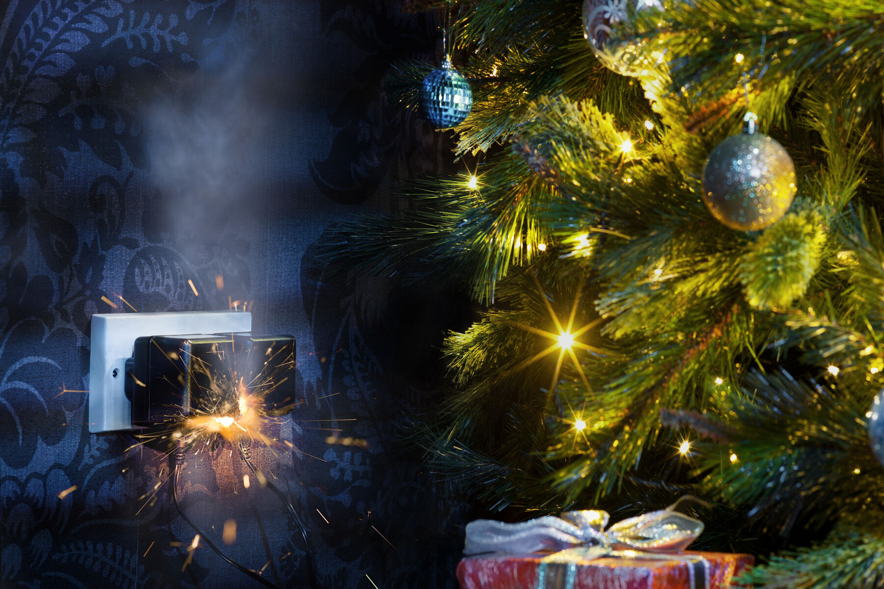 Christmas tree with overloaded electrical outlet