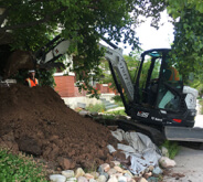 Crane digging in dirt mound in Salt Lake City