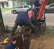 Men digging hole in Wichita