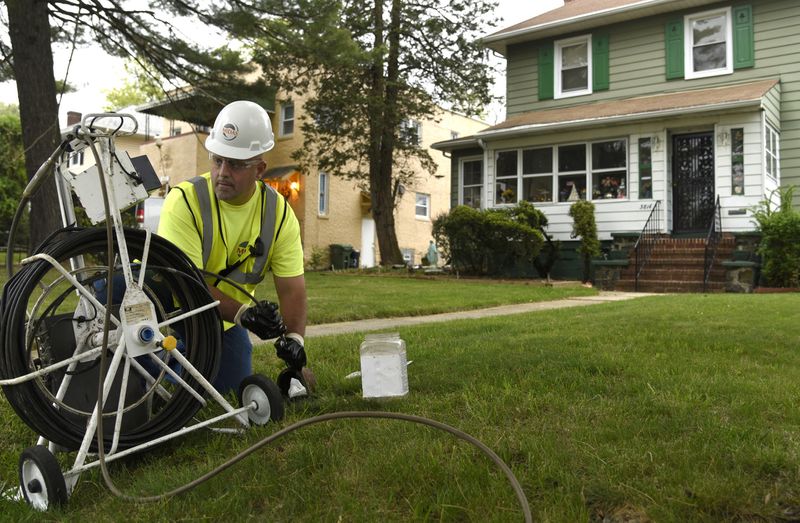 Field technician Jeff Howard uses a camera that can be snaked into drains to inspect sewer lines in the Ashburton neighborhood of West Baltimore. (Barbara Haddock Taylor / Baltimore Sun)